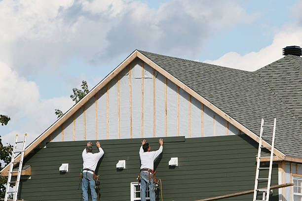 Professional Siding Repair technician working in Russells Point, OH